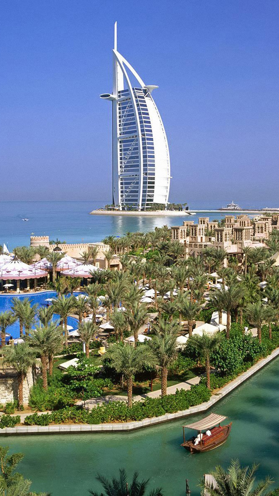 White and Brown Concrete Building Near Body of Water During Daytime. Wallpaper in 1080x1920 Resolution