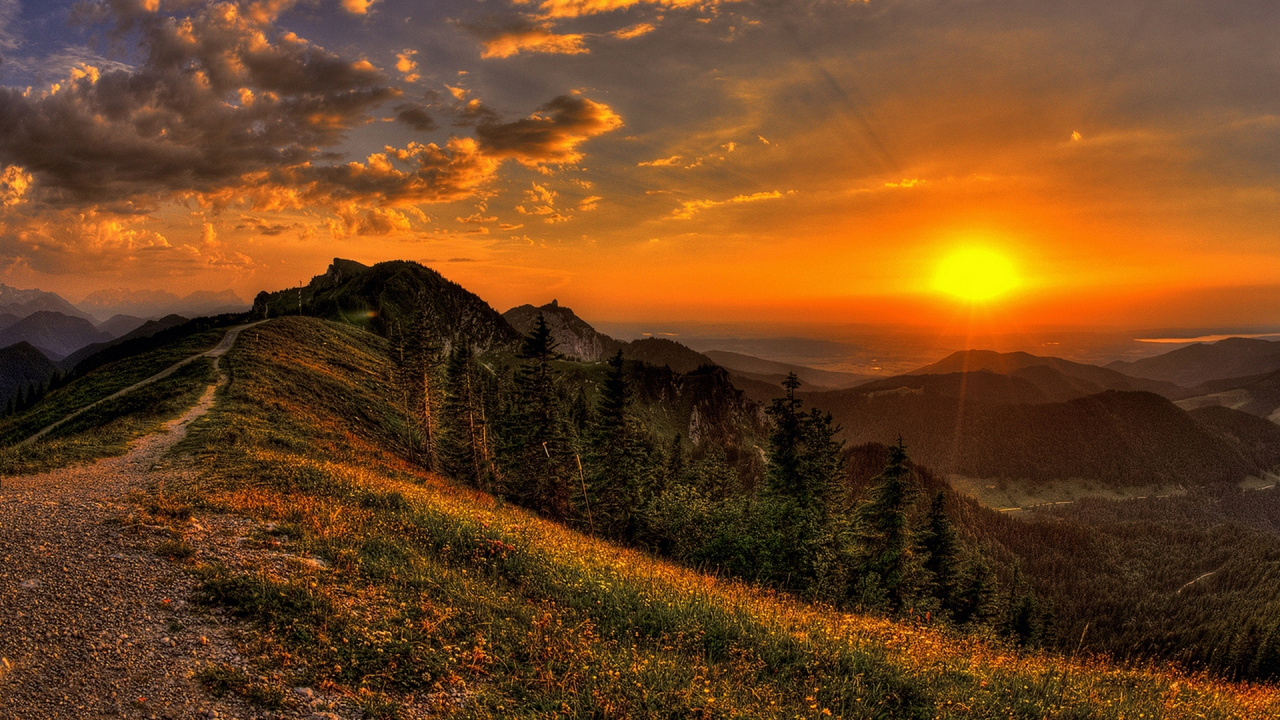 Green Grass Field Near Mountain During Sunset. Wallpaper in 1280x720 Resolution