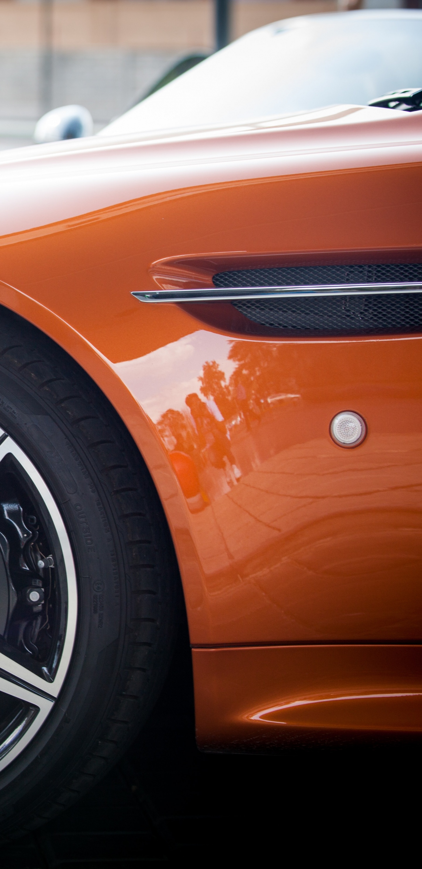 Orange and Black Car on Gray Pavement. Wallpaper in 1440x2960 Resolution