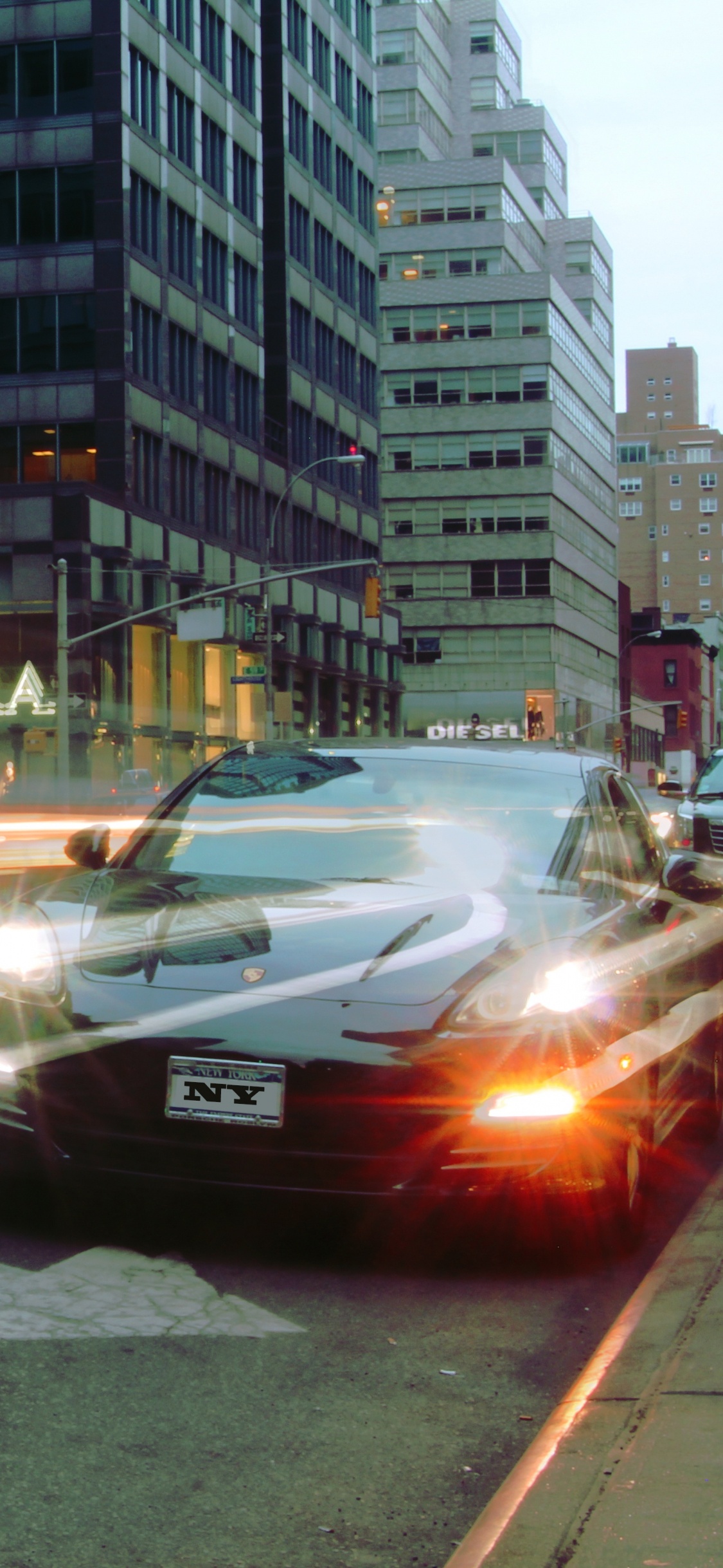 Black Sedan on Road During Daytime. Wallpaper in 1125x2436 Resolution
