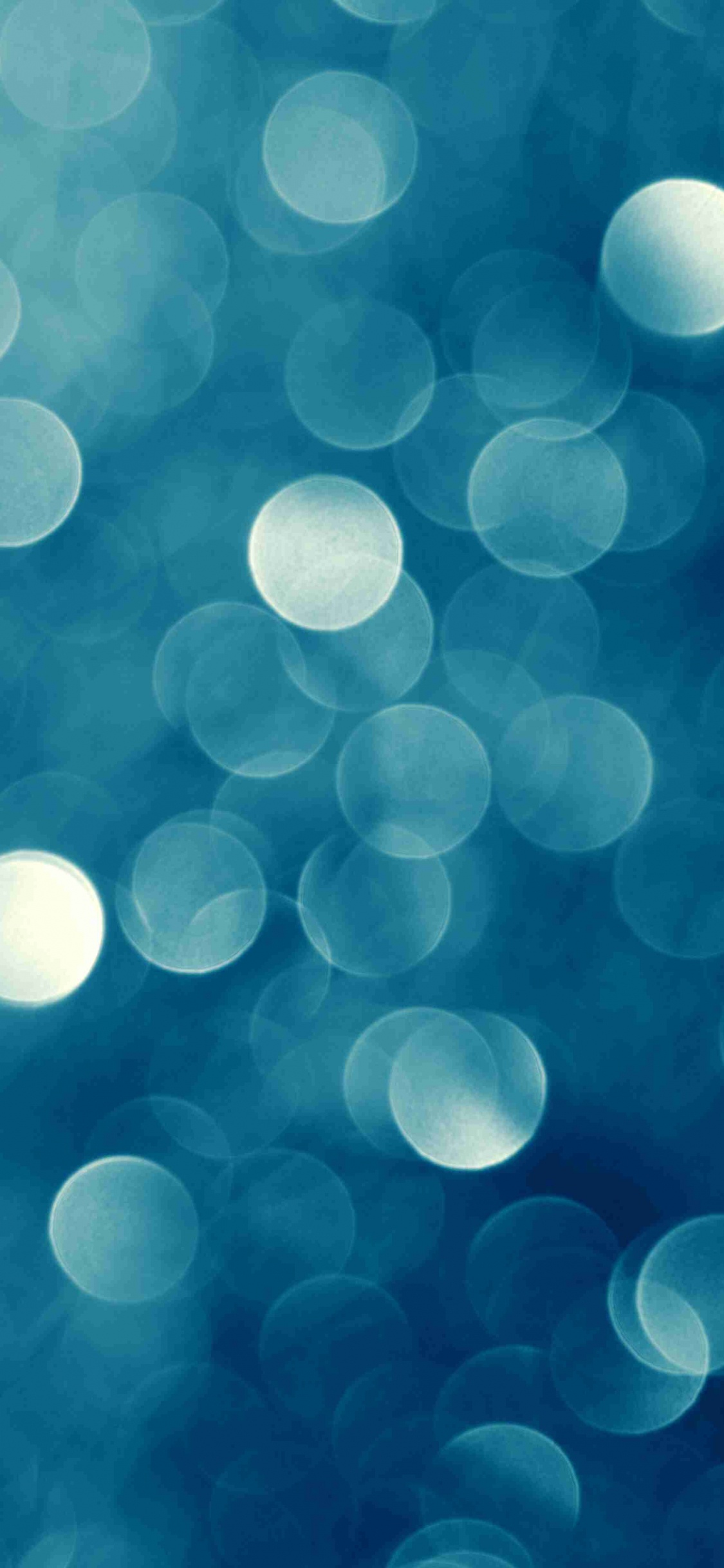 White and Blue Bokeh Lights. Wallpaper in 1125x2436 Resolution