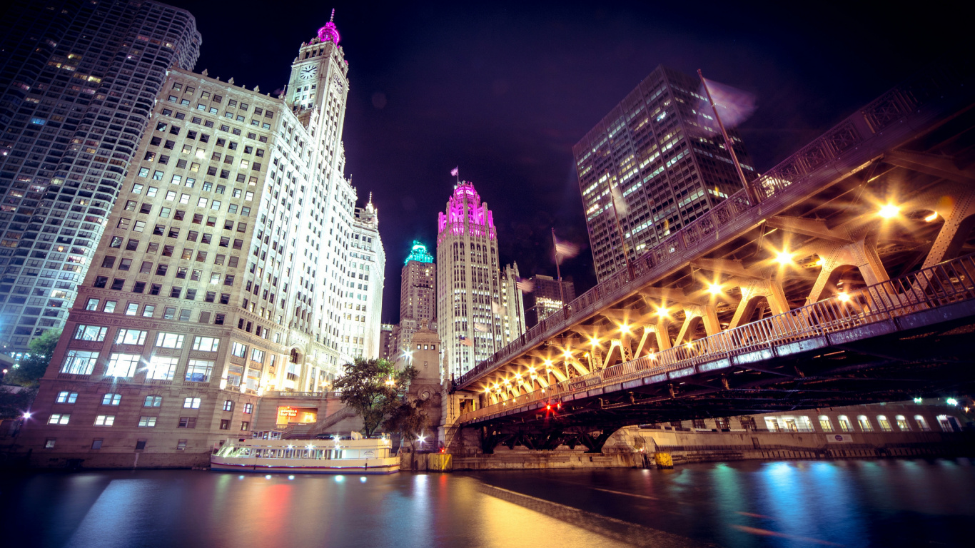 White Concrete Building Near Bridge During Night Time. Wallpaper in 1366x768 Resolution
