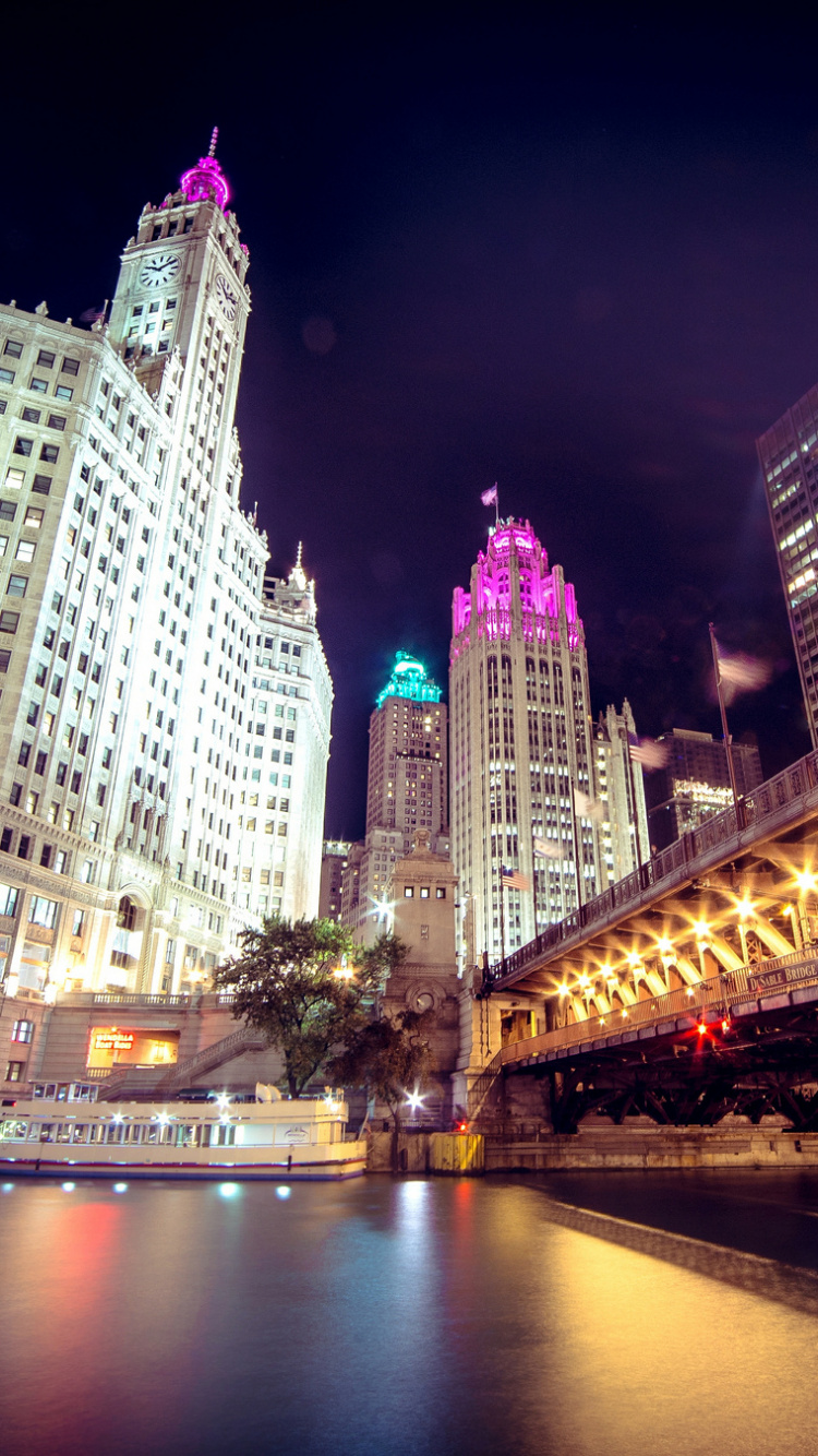 White Concrete Building Near Bridge During Night Time. Wallpaper in 750x1334 Resolution