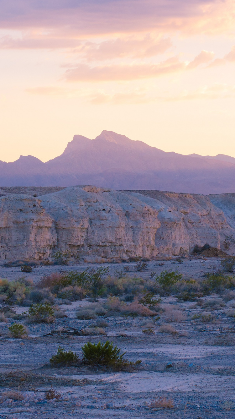 Brown Rocky Mountain Under White Clouds During Daytime. Wallpaper in 750x1334 Resolution