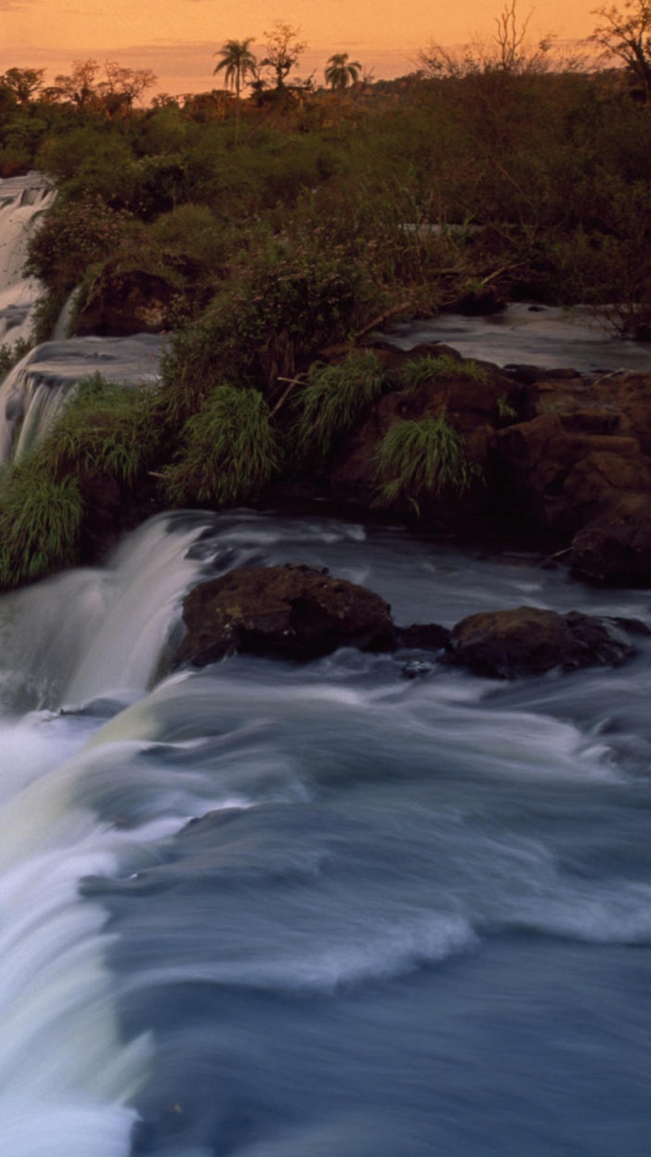 Waterfalls in The Middle of Forest During Sunset. Wallpaper in 720x1280 Resolution