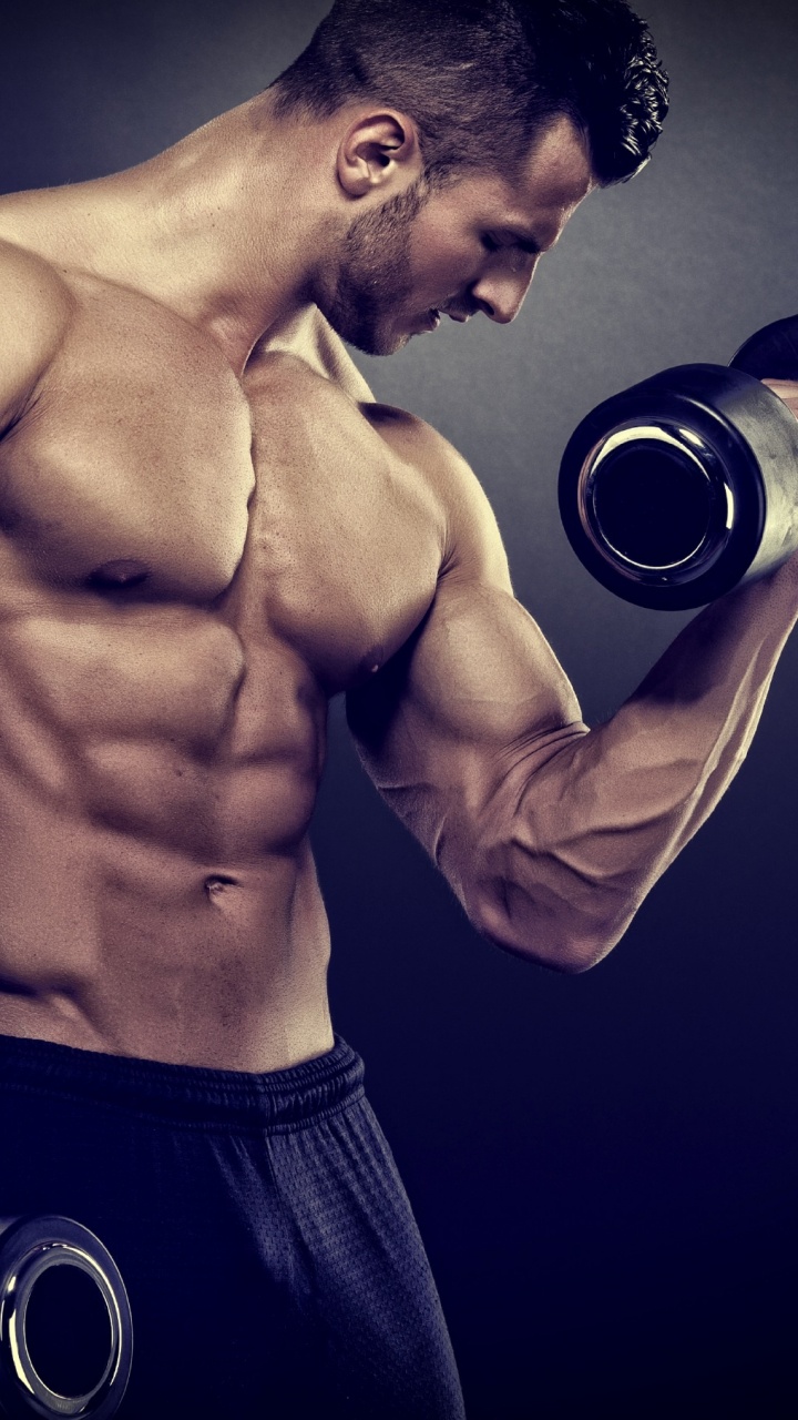 Topless Man in Black Shorts Holding Black and Silver Dumbbell. Wallpaper in 720x1280 Resolution