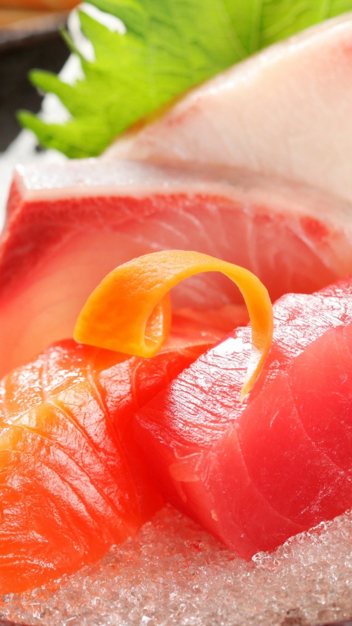 Sliced of Orange Fruit on Black Plate. Wallpaper in 720x1280 Resolution