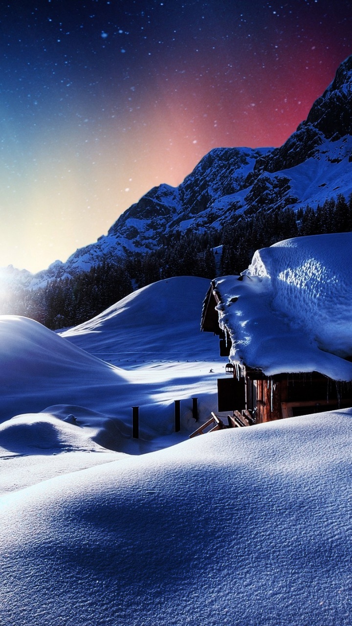 Maison en Bois Marron Sur un Sol Couvert de Neige Pendant la Nuit. Wallpaper in 720x1280 Resolution
