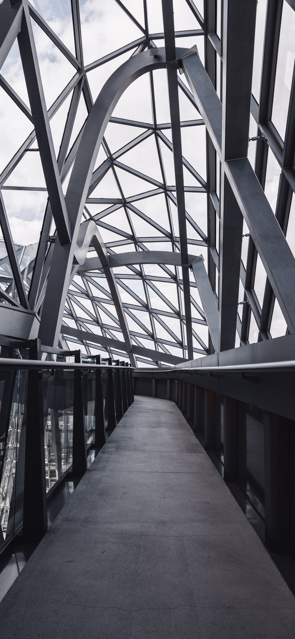 Gray Metal Bridge During Daytime. Wallpaper in 1125x2436 Resolution