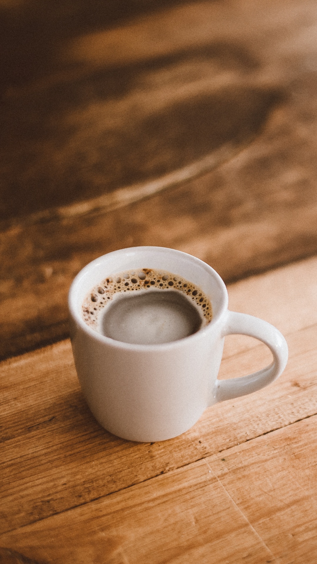 White Ceramic Mug on Brown Wooden Table. Wallpaper in 1080x1920 Resolution