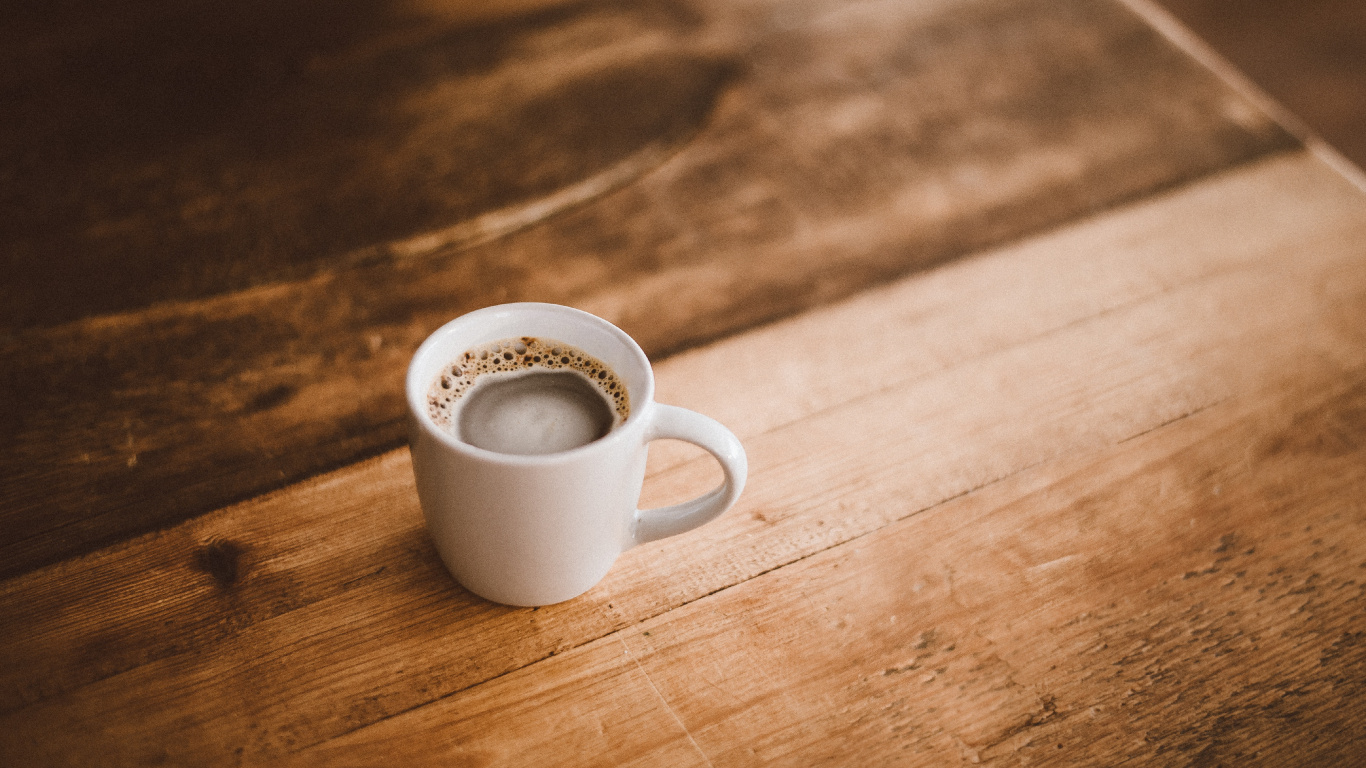 White Ceramic Mug on Brown Wooden Table. Wallpaper in 1366x768 Resolution