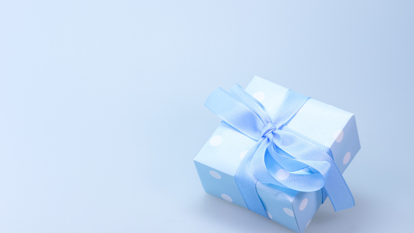 Blue and White Polka Dot Gift Box With White Ribbon. Wallpaper in 1366x768 Resolution