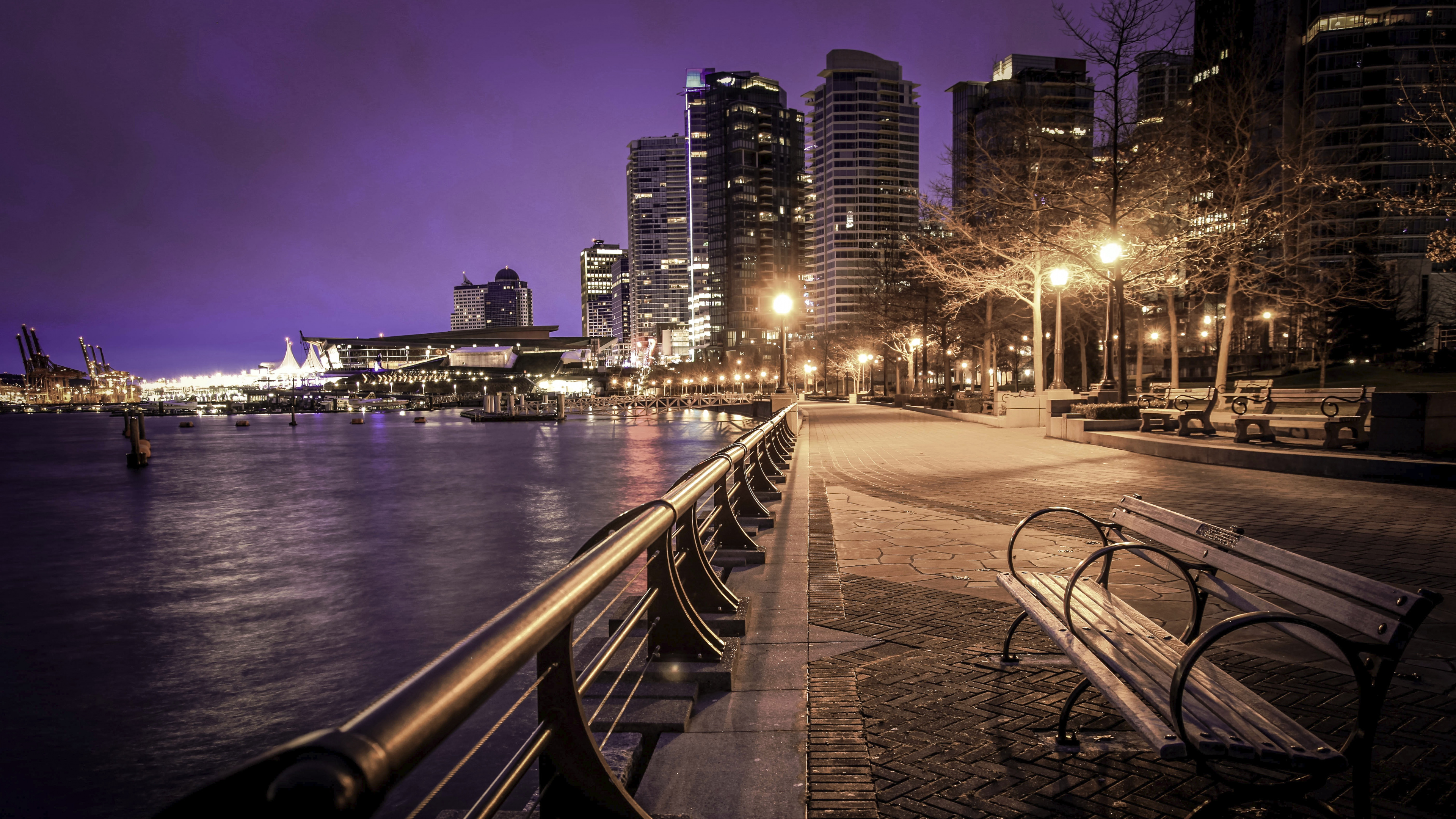 Gray Concrete Bridge Near City Buildings During Night Time. Wallpaper in 3840x2160 Resolution