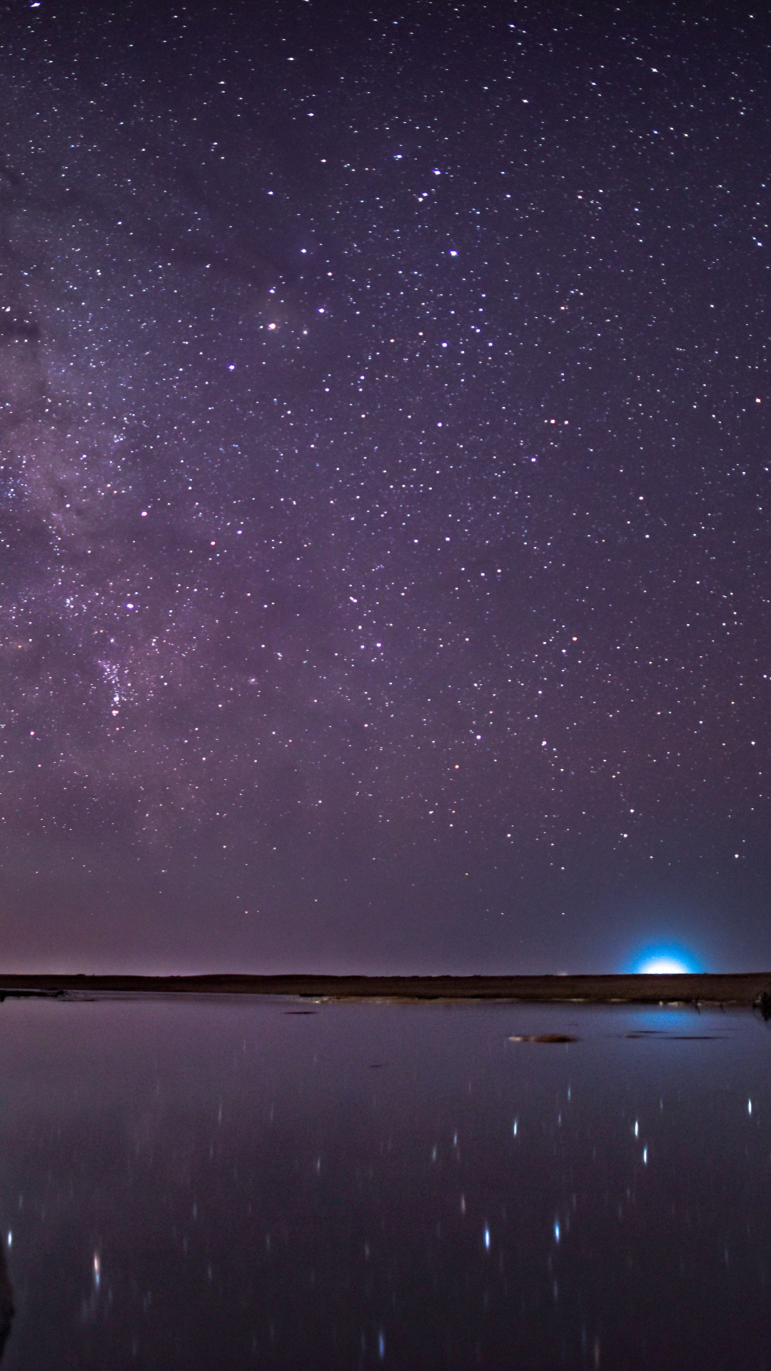 Brown Rock Formation on Body of Water Under Starry Night. Wallpaper in 1080x1920 Resolution