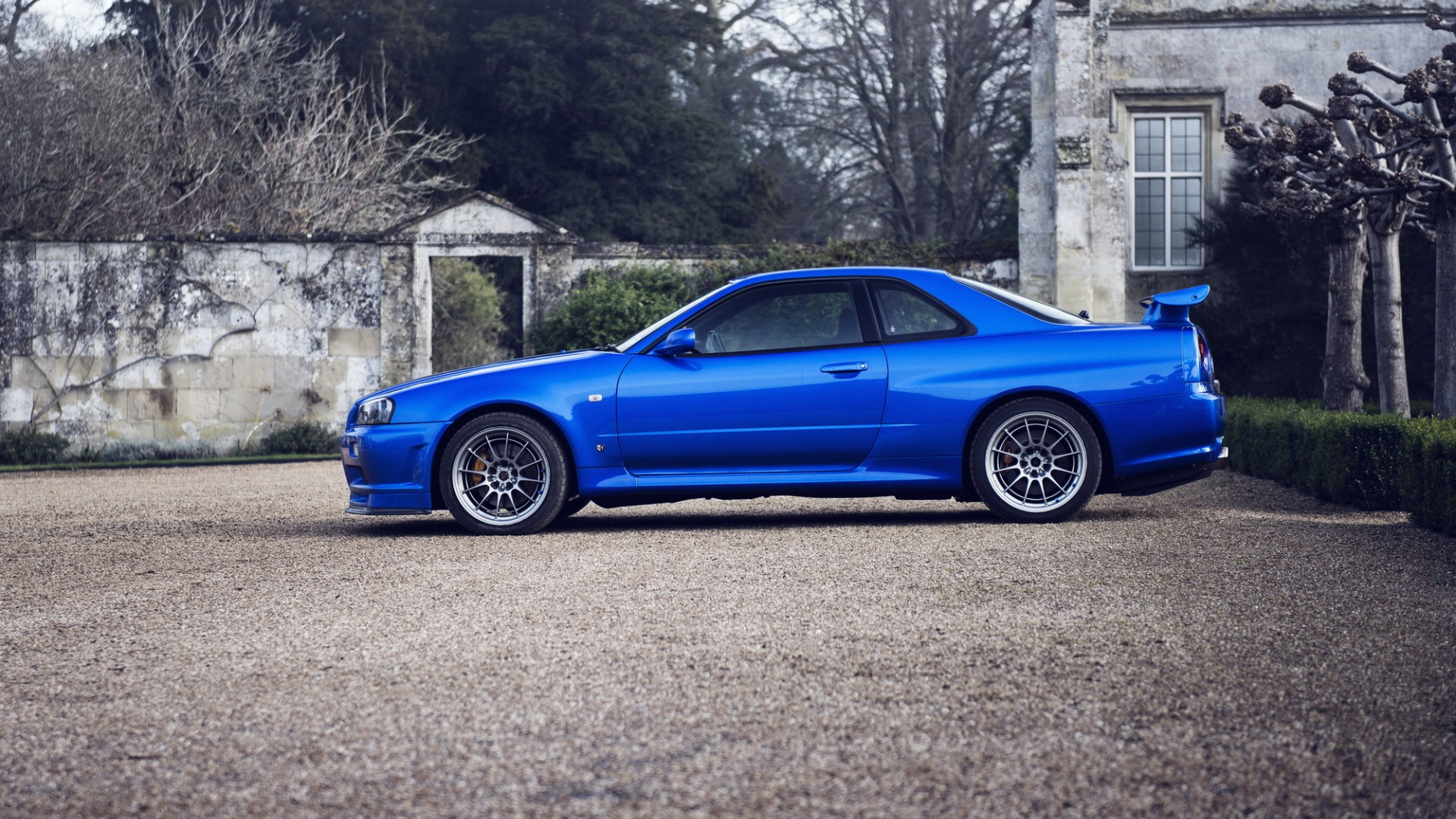 Blue Coupe Parked on Gray Concrete Pavement During Daytime. Wallpaper in 1920x1080 Resolution