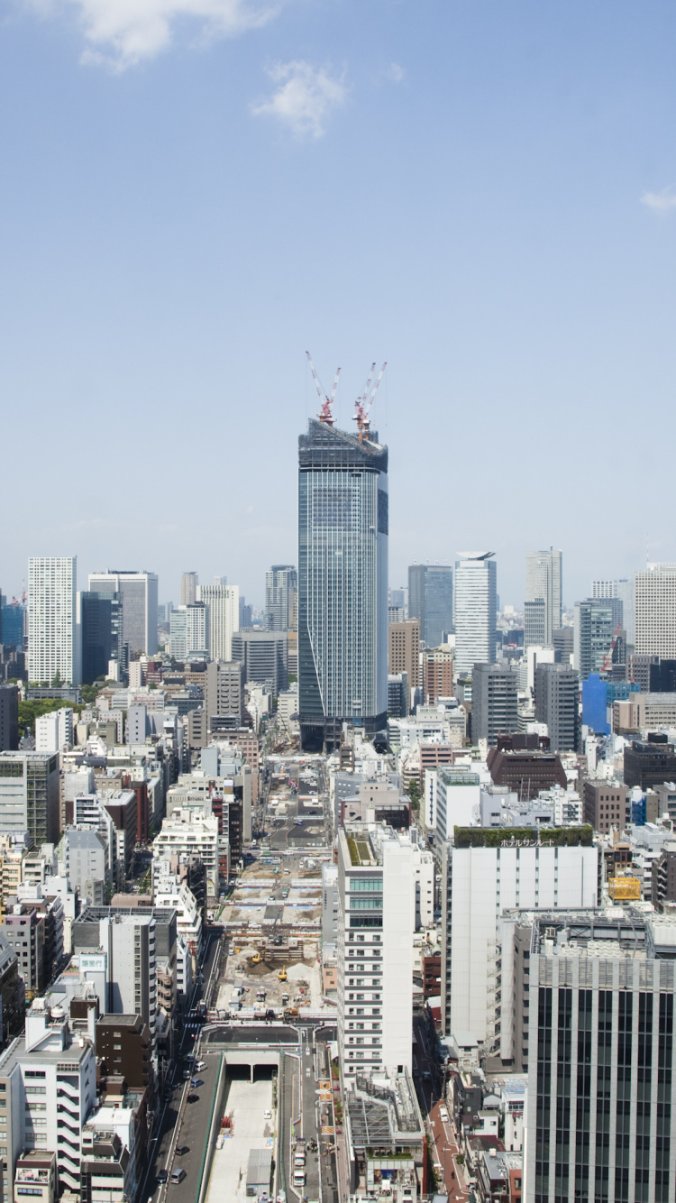 City Skyline Under Blue Sky During Daytime. Wallpaper in 750x1334 Resolution