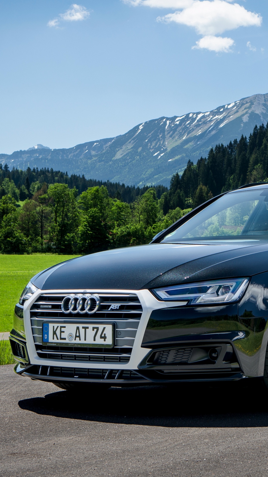 Black Audi Coupe on Road Near Green Grass Field and Green Mountains During Daytime. Wallpaper in 1080x1920 Resolution