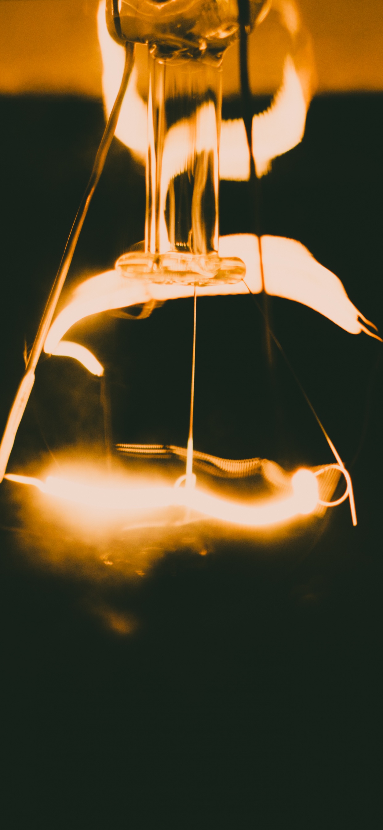 Light Bulb With Light in Dark Background. Wallpaper in 1242x2688 Resolution