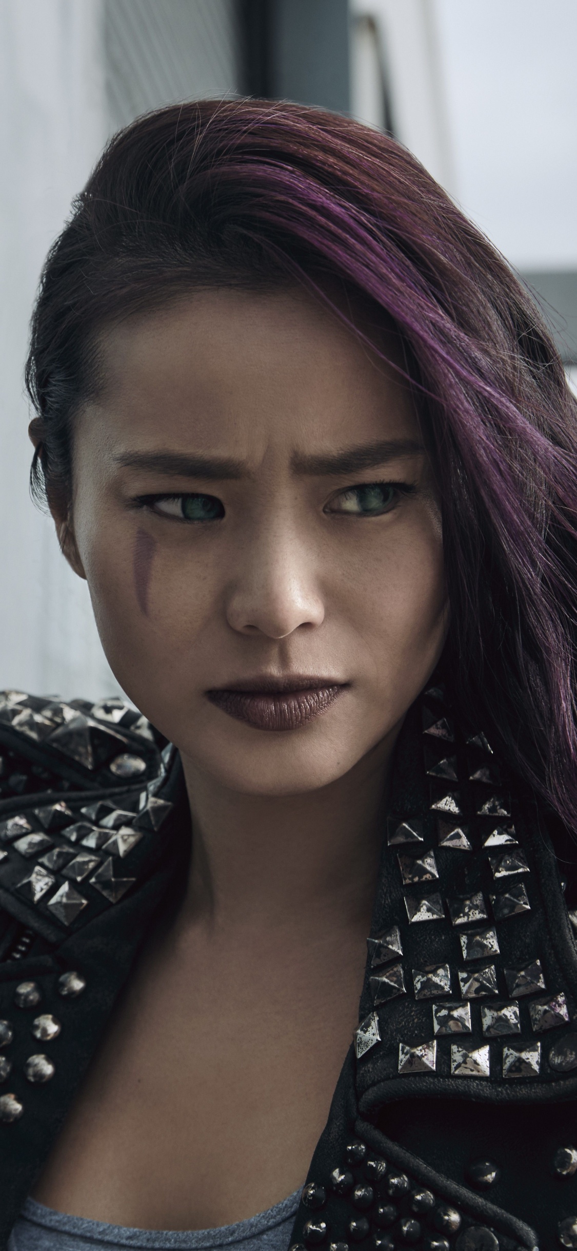 Woman in Black and White Polka Dot Shirt and Black Jacket. Wallpaper in 1125x2436 Resolution