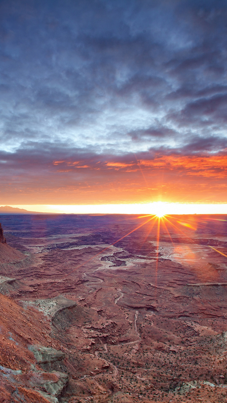 Brown Rocky Mountain During Sunset. Wallpaper in 750x1334 Resolution