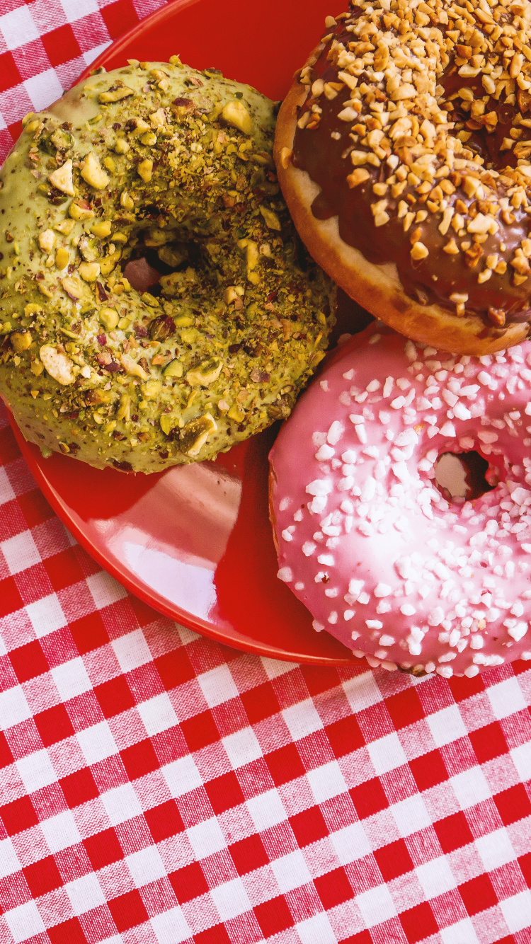 Brown Doughnut on Red and White Checkered Table Cloth. Wallpaper in 750x1334 Resolution