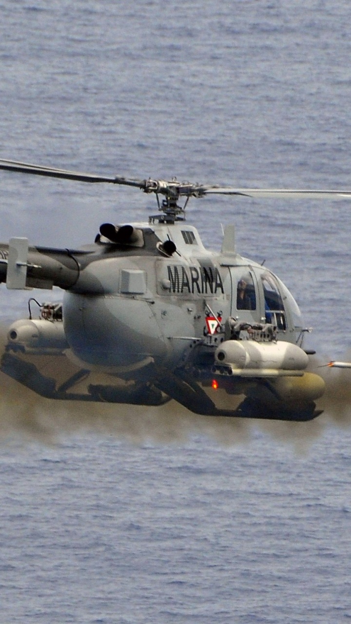 Gray and Black Helicopter Flying Over Sea During Daytime. Wallpaper in 720x1280 Resolution