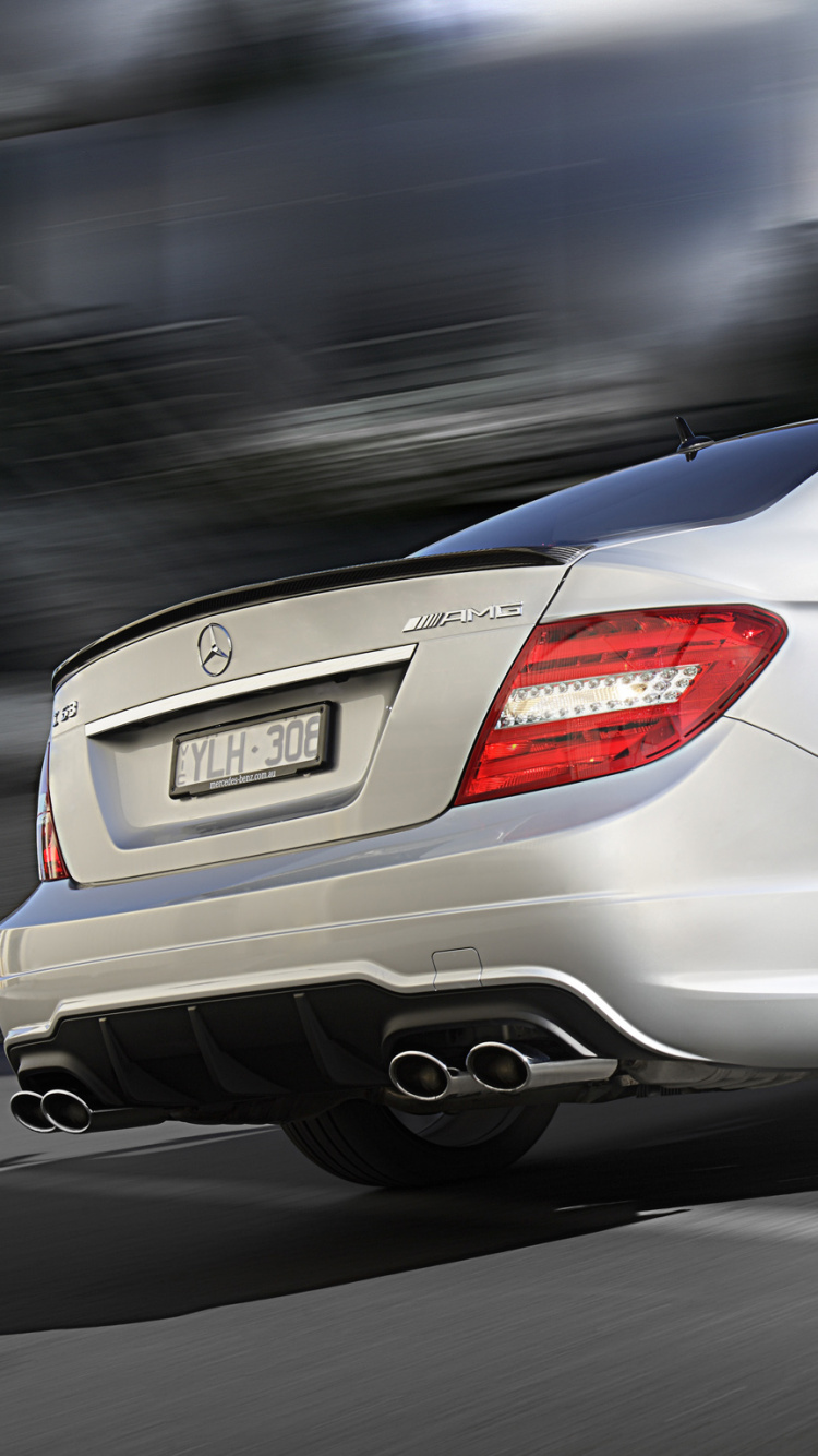 White Mercedes Benz Coupe on Road. Wallpaper in 750x1334 Resolution