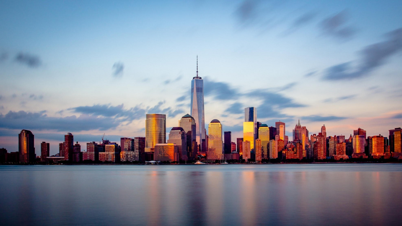City Skyline Across Body of Water During Daytime. Wallpaper in 1280x720 Resolution