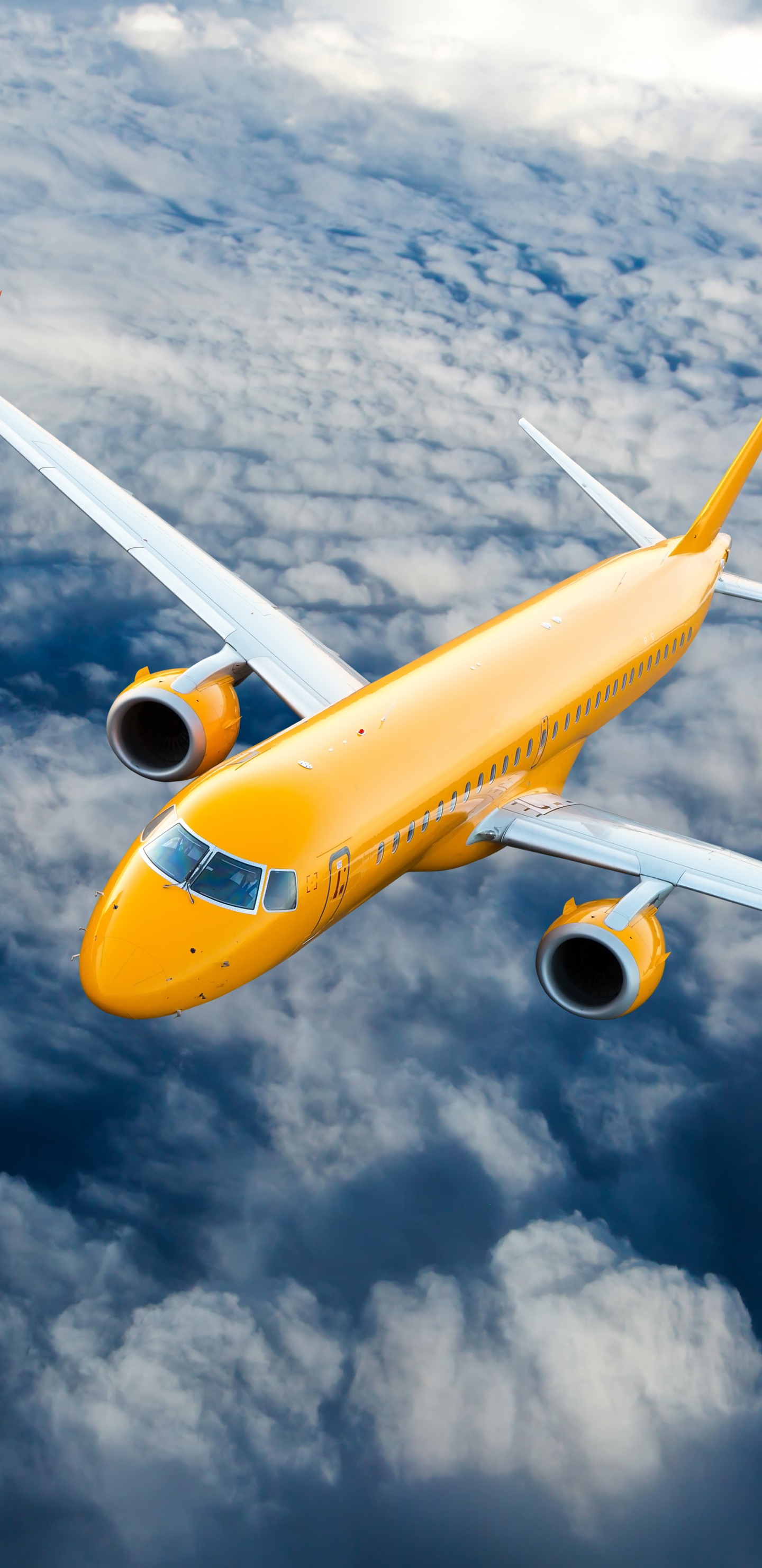 Avión Amarillo y Blanco Volando Bajo Nubes Blancas Durante el Día.. Wallpaper in 1440x2960 Resolution