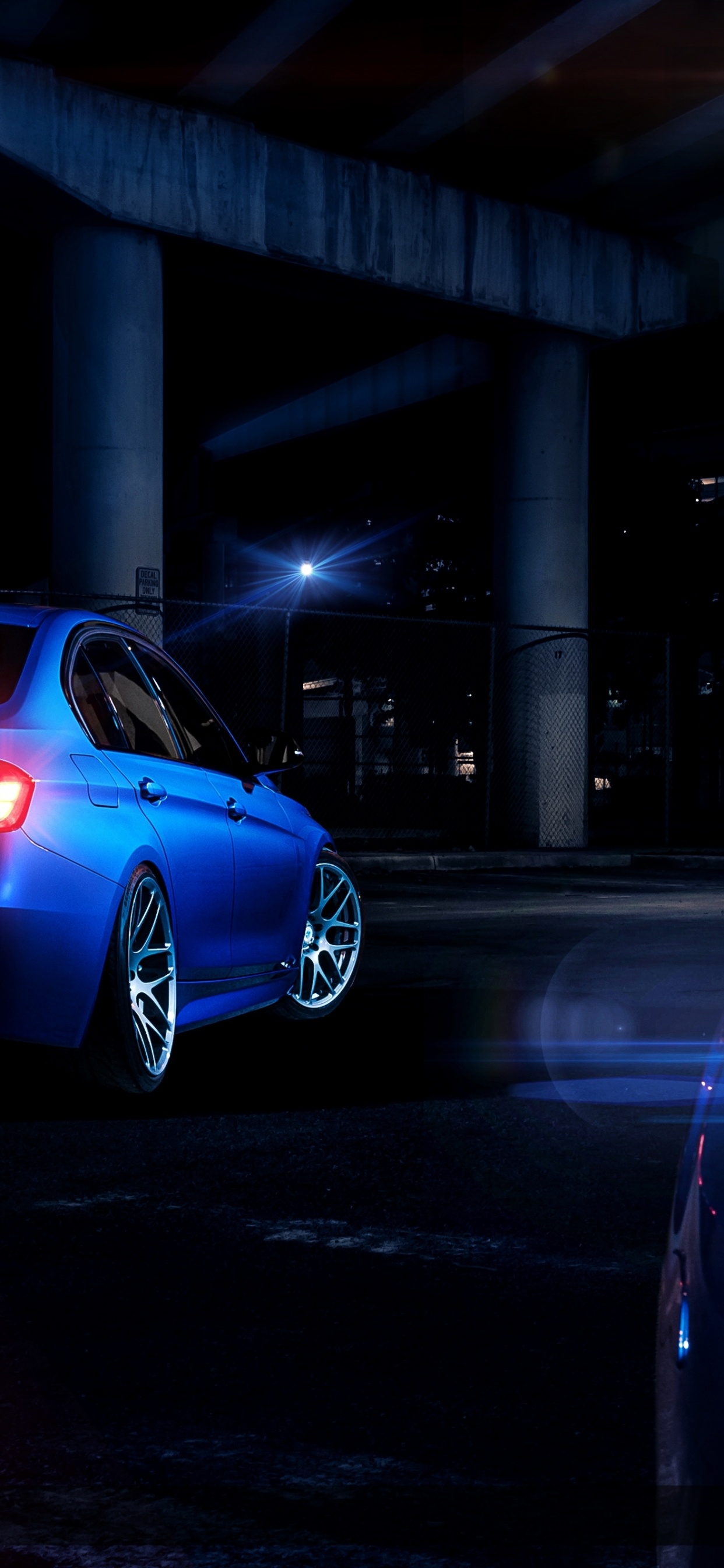 Blue Bmw m 3 Coupe Parked on Parking Lot During Night Time. Wallpaper in 1242x2688 Resolution