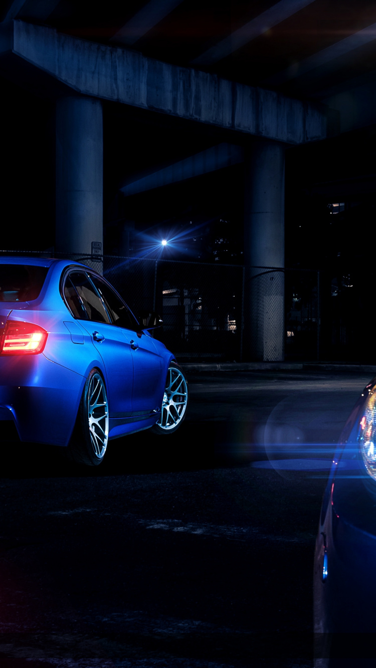 Blue Bmw m 3 Coupe Parked on Parking Lot During Night Time. Wallpaper in 750x1334 Resolution