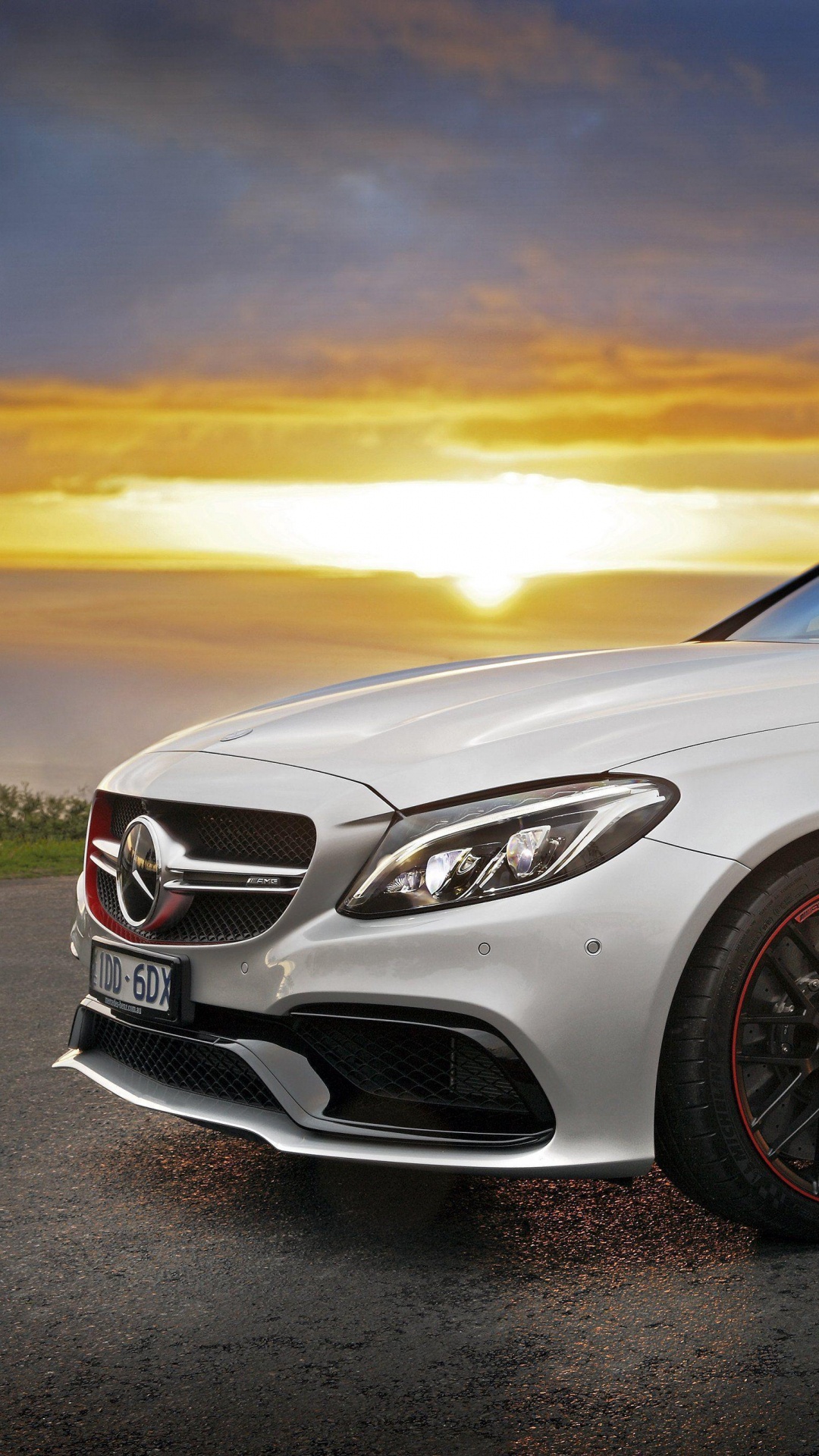Silver Mercedes Benz Coupe on Gray Asphalt Road During Sunset. Wallpaper in 1080x1920 Resolution