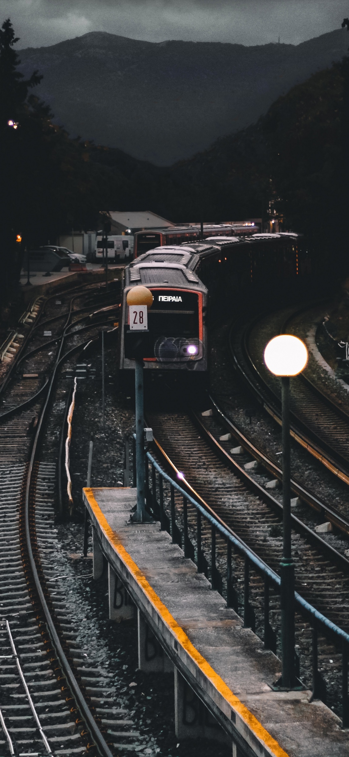 Train on Rail Road During Daytime. Wallpaper in 1125x2436 Resolution