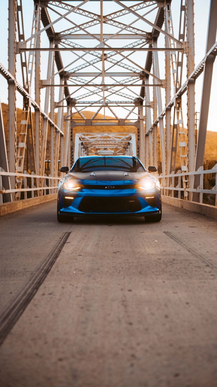 Blue Ferrari Car on Road During Daytime. Wallpaper in 720x1280 Resolution