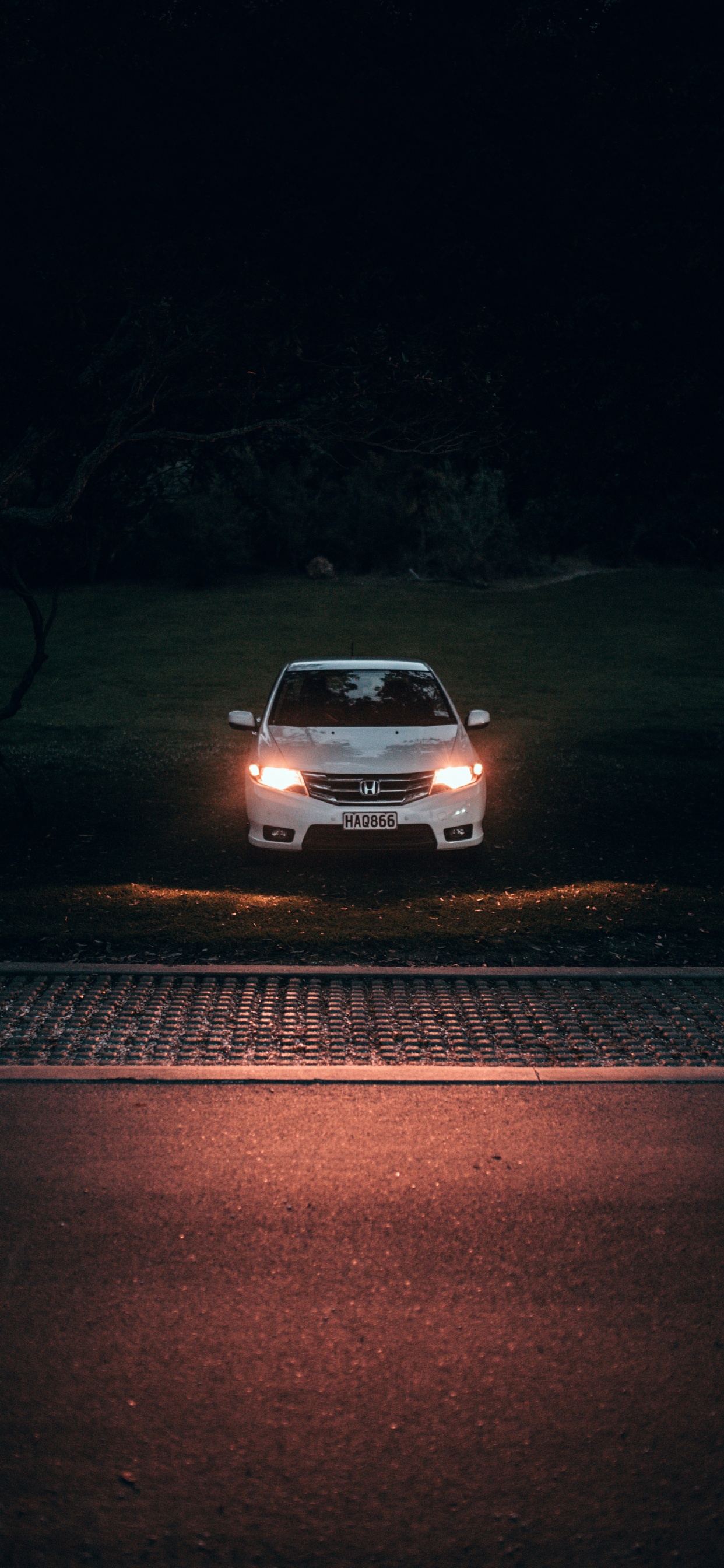 White Car on Road During Night Time. Wallpaper in 1242x2688 Resolution