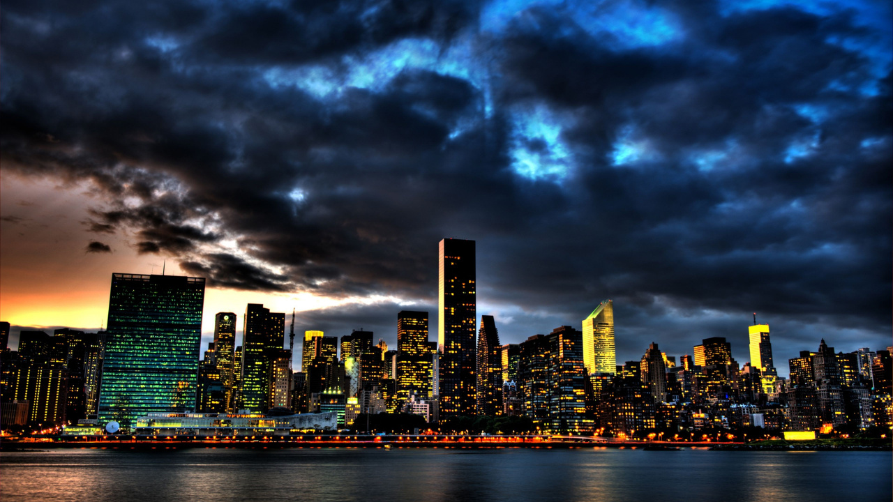 City Skyline Under Gray Clouds. Wallpaper in 1280x720 Resolution