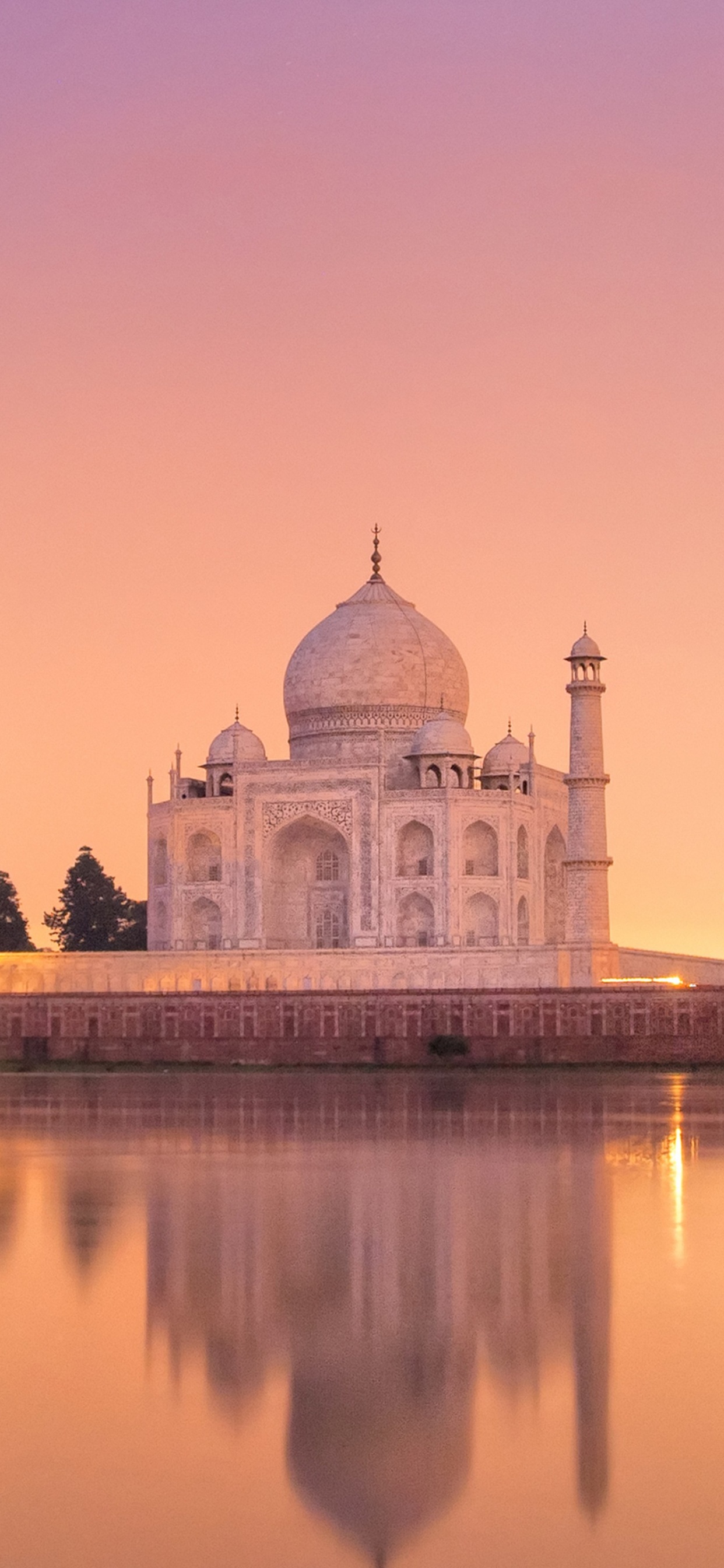 White Dome Building Near Body of Water During Sunset. Wallpaper in 1242x2688 Resolution