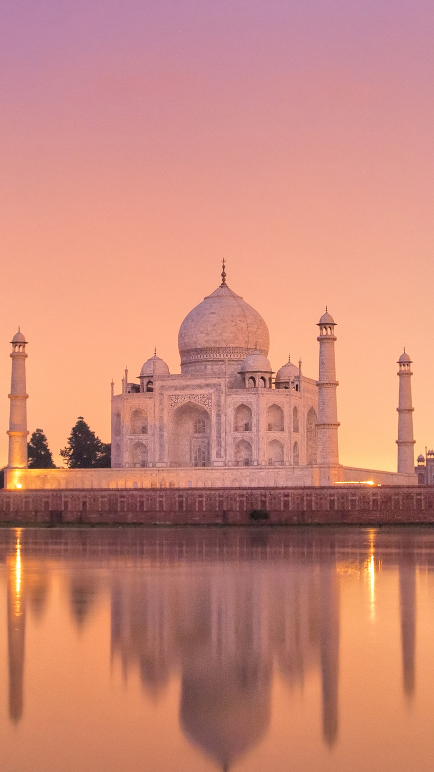 White Dome Building Near Body of Water During Sunset. Wallpaper in 1440x2560 Resolution