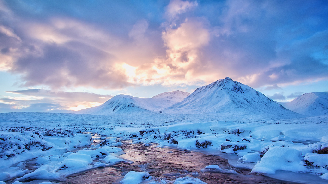 Snow Covered Mountain Under Cloudy Sky During Daytime. Wallpaper in 1366x768 Resolution