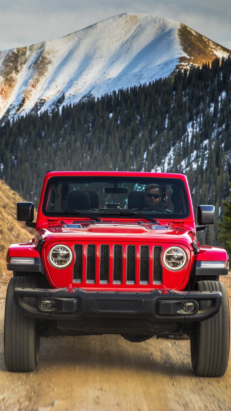 Roter Jeep Wrangler Auf Brauner Schotterstraße Tagsüber During. Wallpaper in 750x1334 Resolution
