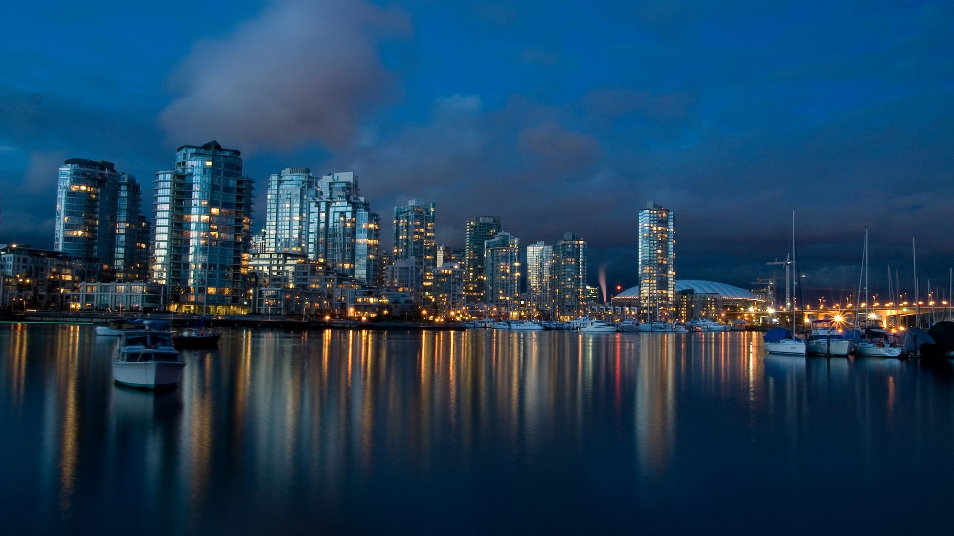 City Skyline Across Body of Water During Night Time. Wallpaper in 1920x1080 Resolution