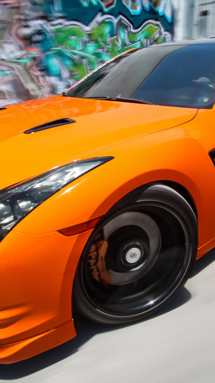 Orange Lamborghini Aventador in a Room. Wallpaper in 720x1280 Resolution