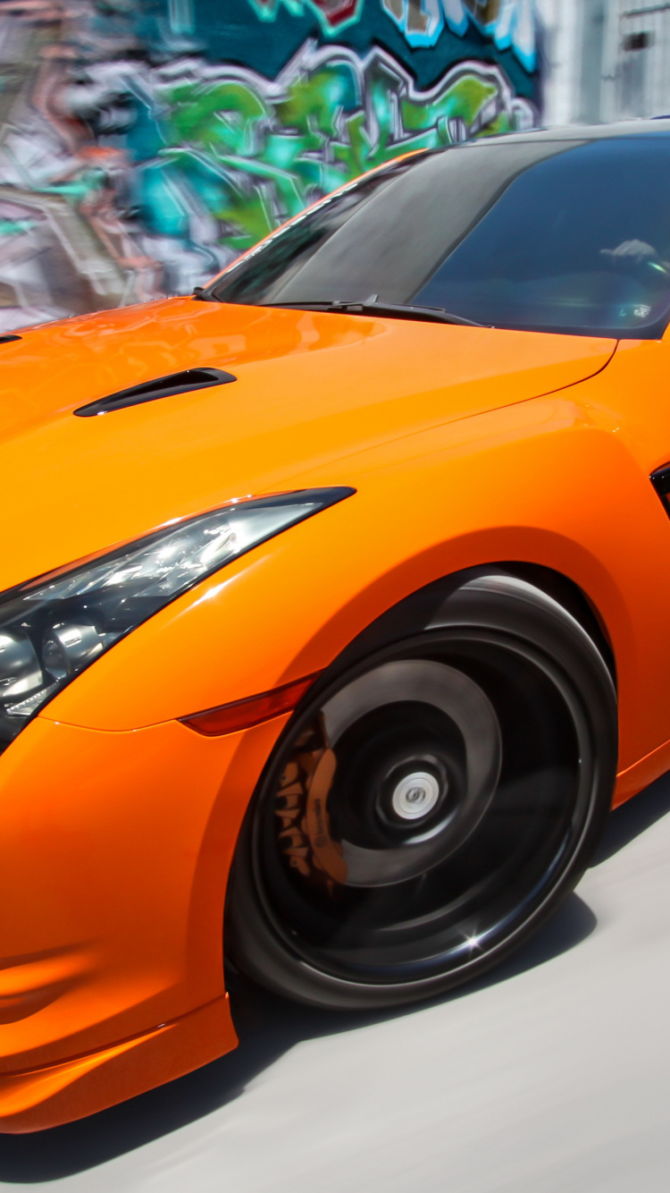 Orange Lamborghini Aventador in a Room. Wallpaper in 750x1334 Resolution
