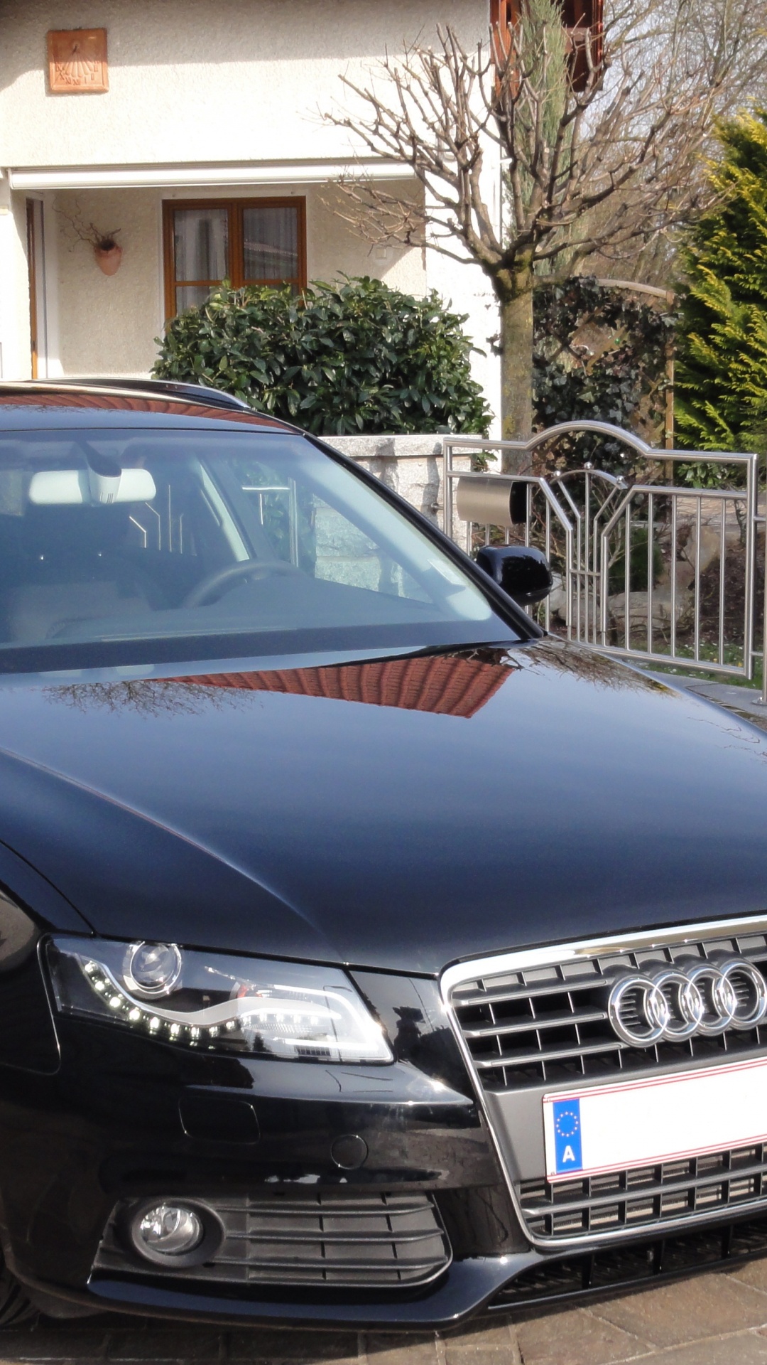 Blue Audi a 4 Coupe Parked on Sidewalk During Daytime. Wallpaper in 1080x1920 Resolution