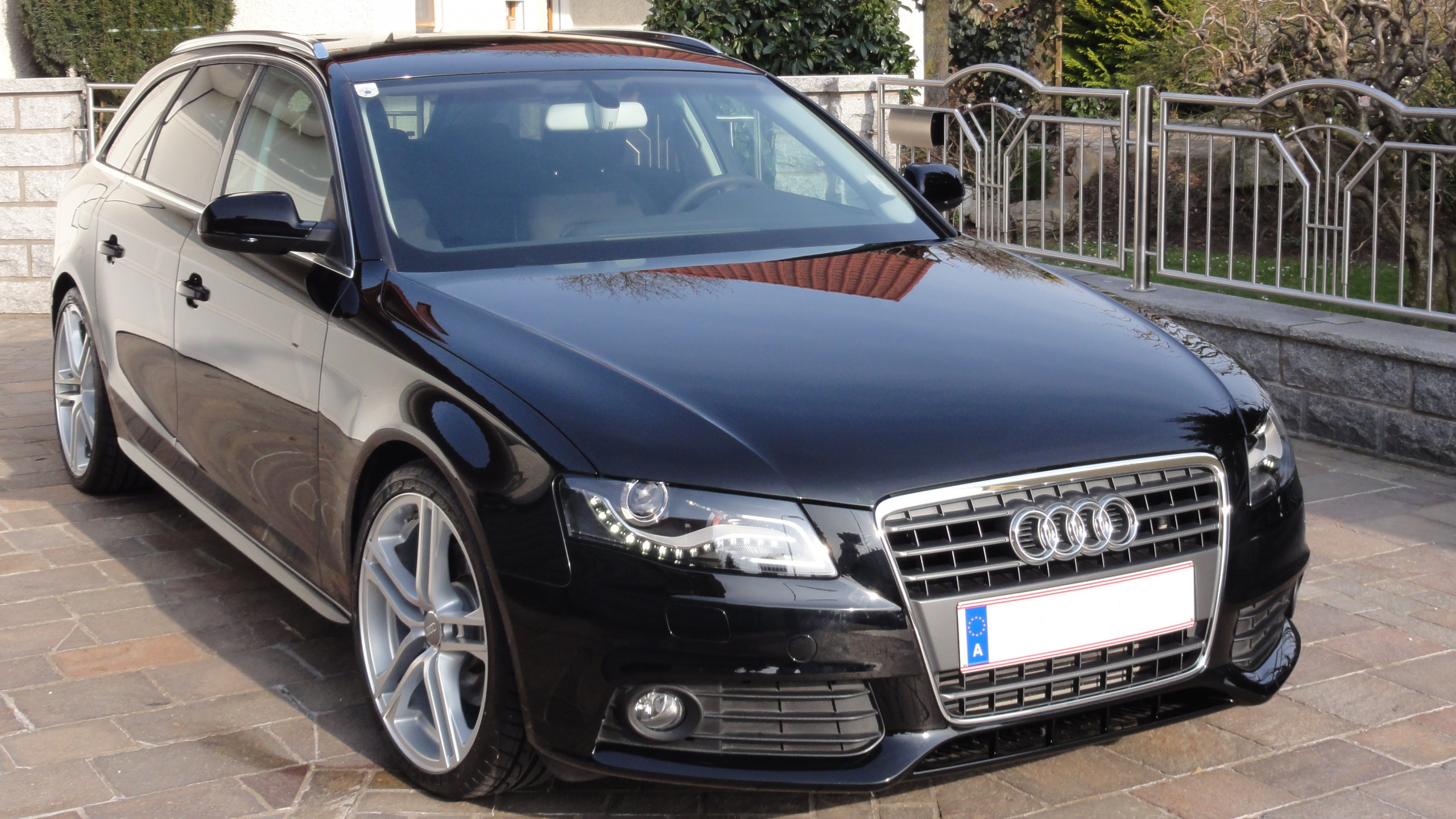 Blue Audi a 4 Coupe Parked on Sidewalk During Daytime. Wallpaper in 2560x1440 Resolution