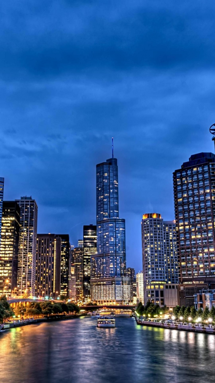 City Skyline Near Body of Water During Night Time. Wallpaper in 720x1280 Resolution