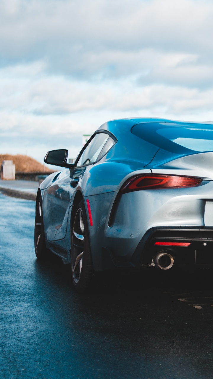 Black Porsche 911 on Beach Shore During Daytime. Wallpaper in 720x1280 Resolution