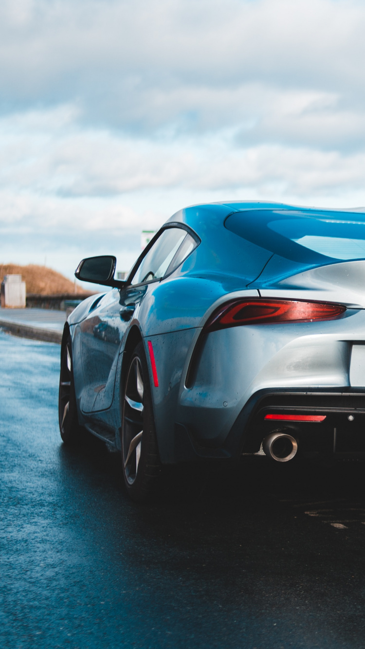 Black Porsche 911 on Beach Shore During Daytime. Wallpaper in 750x1334 Resolution