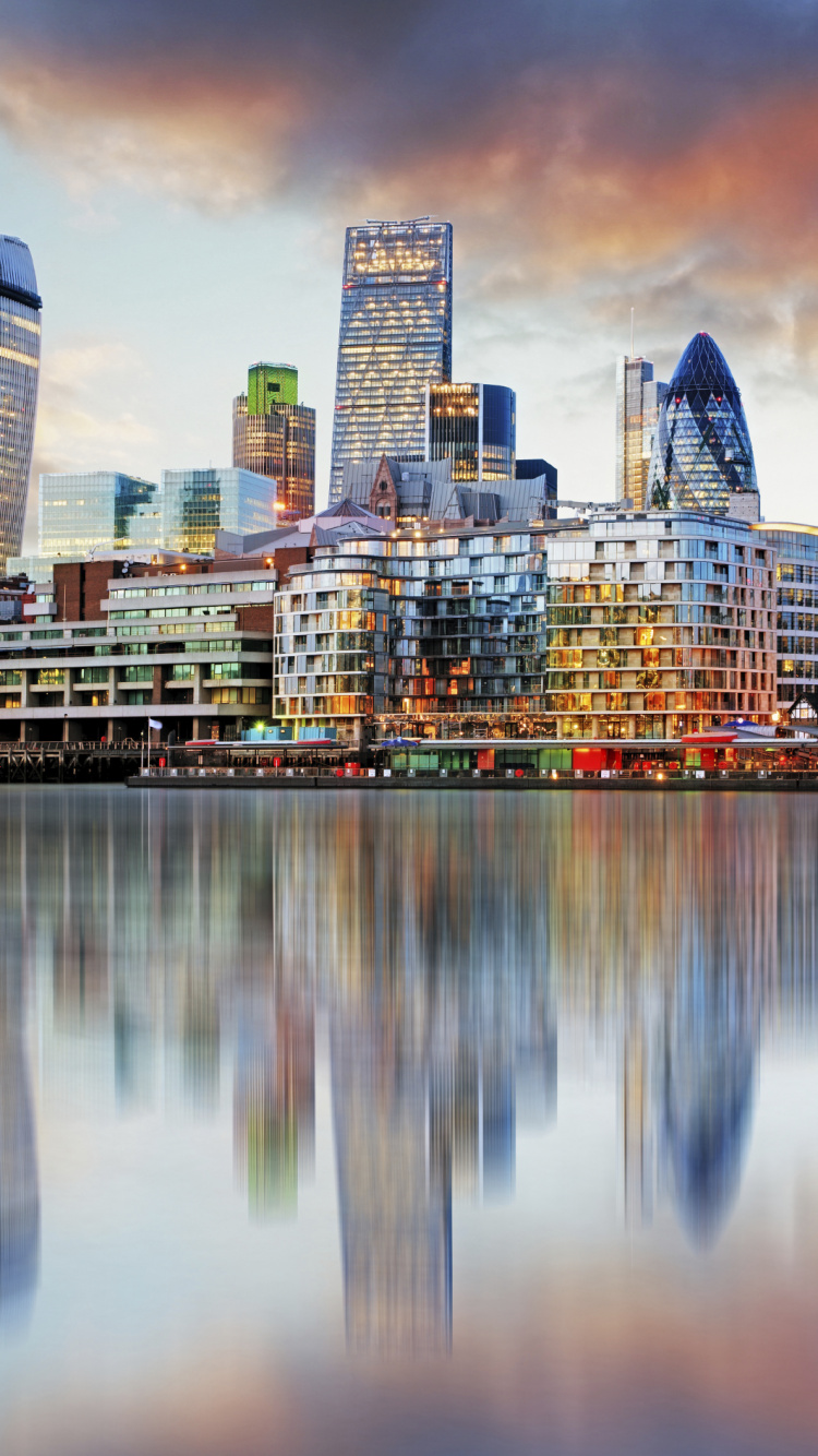 City Skyline Across Body of Water During Night Time. Wallpaper in 750x1334 Resolution
