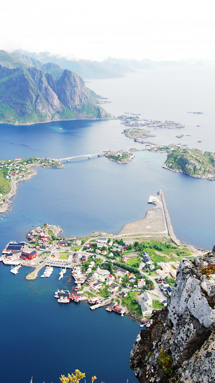 Aerial View of Green and Brown Mountains Beside Body of Water During Daytime. Wallpaper in 750x1334 Resolution